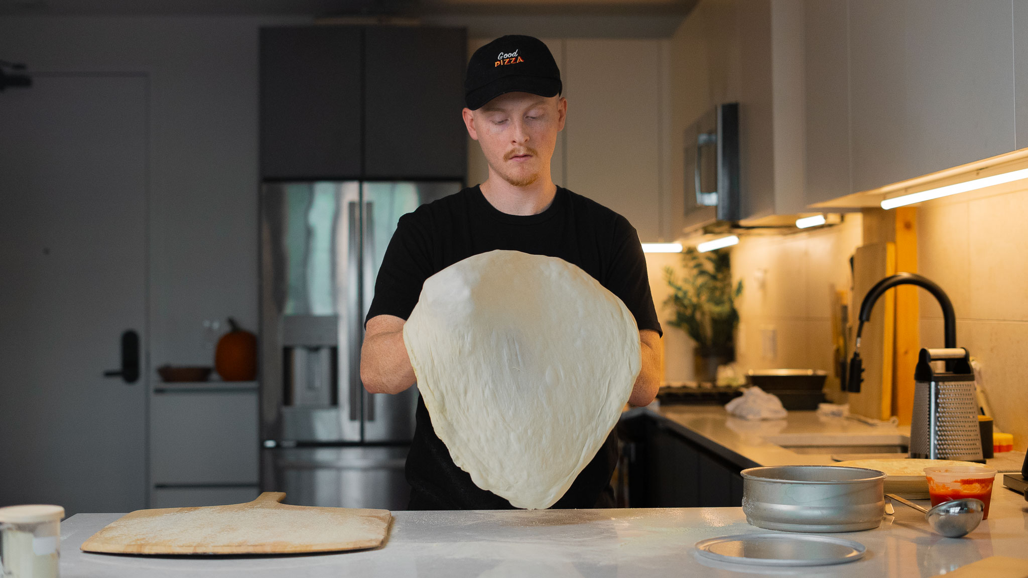 Charlie making pizza at home